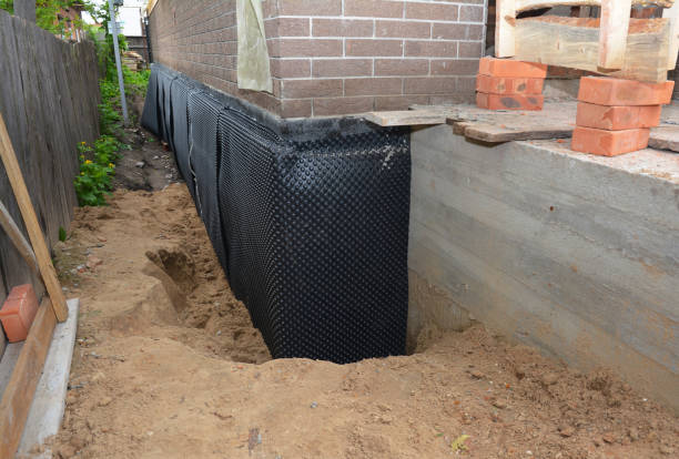 SJ Waterproofing Pros technician performing targeted Interior Drainage System assessment in Englewood Cliffs, NJ